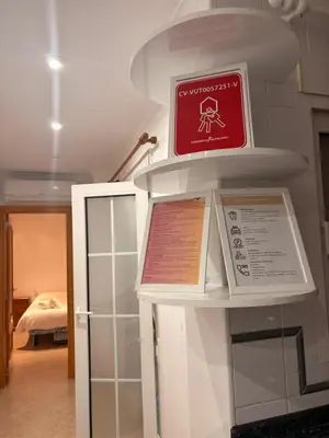 a sign on a shelf in a room at Apartamento en Primera Linea de Playa en Mareny de Barraquetes-Vistas al Mar-El Refugio del Mediterráneo in Mareny Barraquetas