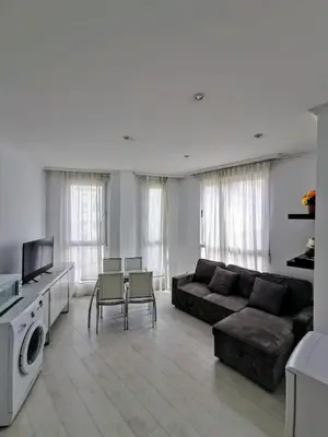 a living room with a couch and a tv at Apartment Ruzafa Market 7C in Valencia