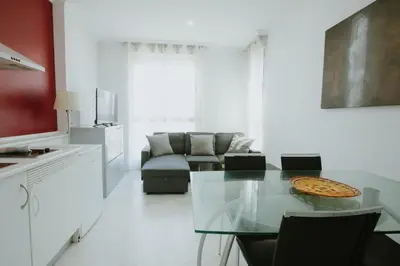 a living room with a glass table and a couch at Apartment Ruzafa Market 7D in Valencia