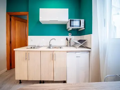 a kitchen with a sink and a microwave at Apartment Ruzafa Market 8A in Valencia
