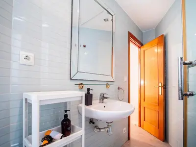 a bathroom with a sink and a mirror at Apartment Ruzafa Market 8A in Valencia