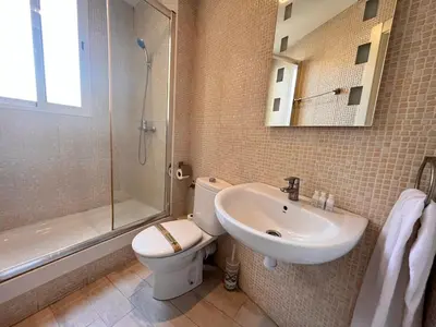 a bathroom with a toilet and a sink and a shower at Apartment Ruzafa Market 8B in Valencia