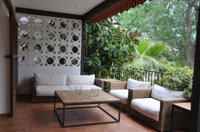 a patio with couches and a table on a balcony at Ideal apartment in Náquera, Pool, Wifi in Náquera