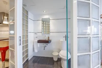 a bathroom with a toilet and a sink at Gatova Sunset Retreat in Gátova