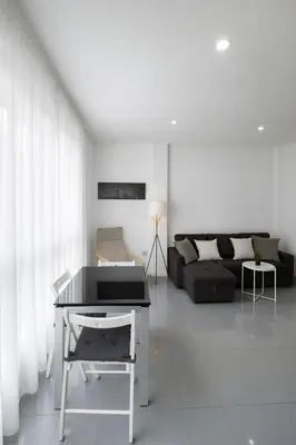 a living room with a table and a couch at Your Apartment In The Center-Ruzafa 8C in Valencia