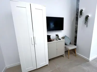 a white cabinet in a room with a tv at PN4- Loft Valencia N4 Urban Ayora in Valencia