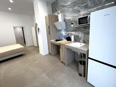 a small kitchen with a sink and a refrigerator at PN4- Loft Valencia N4 Urban Ayora in Valencia