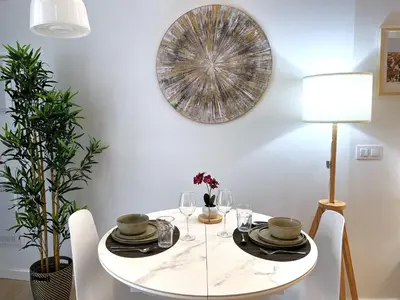 a white dining room with a white table and chairs at PN4- Loft Valencia N4 Urban Ayora in Valencia