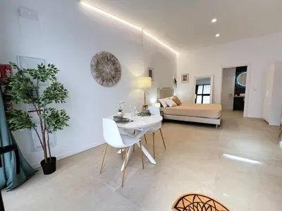 a living room with a table and a couch at PN4- Loft Valencia N4 Urban Ayora in Valencia