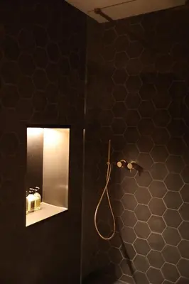 a black bathroom with a mirror and a shower at Espacio Biocompatible - Villa Raíz in Requena