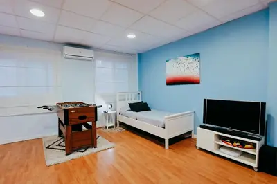 a living room with a tv and a couch and a table at Fun Apt, City of Arts, ChillOut Zone, Soccer Table in Valencia