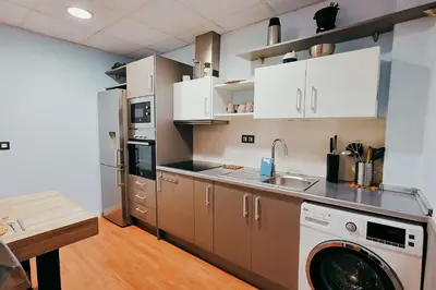 a kitchen with a washer and a washing machine at Fun Apt, City of Arts, ChillOut Zone, Soccer Table in Valencia