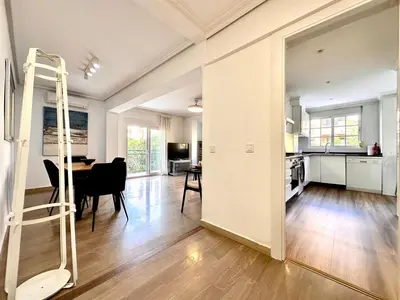 a kitchen and dining room with a ladder in a living room at Seasonal Antonio Suárez in Valencia