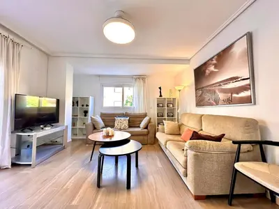 a living room with a couch and a table at Seasonal Antonio Suárez in Valencia