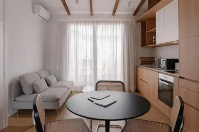 a small living room with a table and a couch at Burriana X - Estudio in Valencia