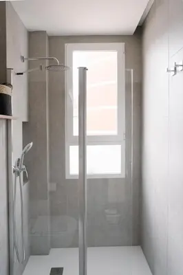 a bathroom with a shower with a glass door at Burriana X - Estudio in Valencia