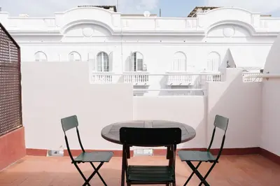 a table and chairs in a room with a building at Burriana X - Estudio in Valencia