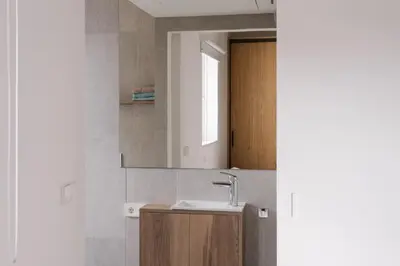 a bathroom with a sink and a mirror at Burriana X - Estudio in Valencia