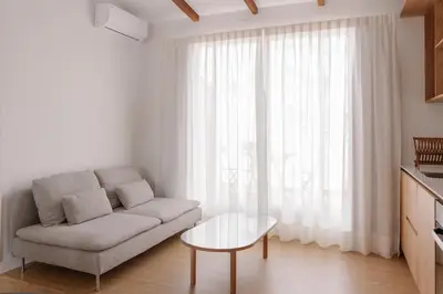 a living room with a couch and a table at Burriana X - Estudio in Valencia
