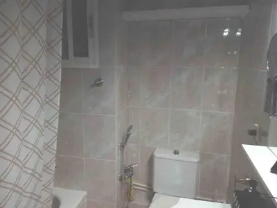 a bathroom with a shower with a toilet and a sink at Beach apartment in Valencia