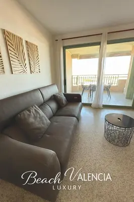 a living room with a couch and a table at BEACH VALENCIA LUXURY D7-21 Apartment with terrace and sea views with two rooms in Valencia