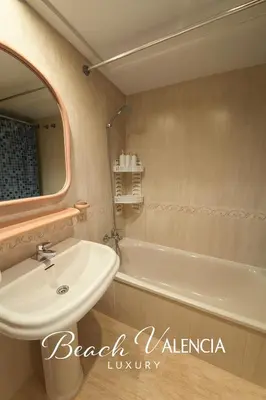 a bathroom with a sink and a bath tub at BEACH VALENCIA LUXURY D7-21 Apartment with terrace and sea views with two rooms in Valencia