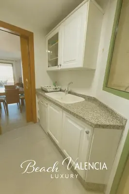 a kitchen with a sink and a counter top at BEACH VALENCIA LUXURY D7-21 Apartment with terrace and sea views with two rooms in Valencia