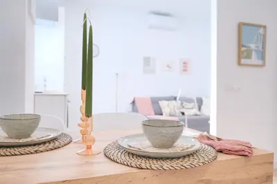 a table with two cups and a candle on it at Suite near to Marathon - City of Arts & Sciences in Valencia