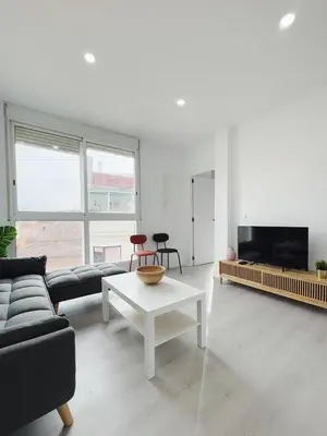 a living room with a couch and a table at Apartment Ruzafa Market 9B in Valencia
