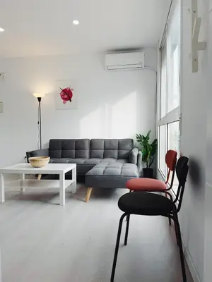 a living room with a couch and a table at Apartment Ruzafa Market 9B in Valencia
