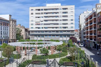 a large white building with a garden in front of it at Apartment 2 bedroom Historical Center in Valencia