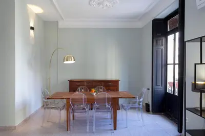 a dining room with a wooden table and chairs at Apartment 2 bedroom Historical Center in Valencia