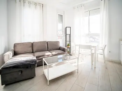 a living room with a couch and a table at Apartment Ruzafa Market 9C in Valencia
