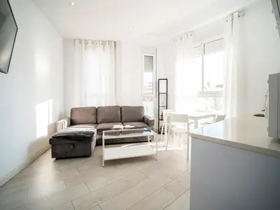 a living room with a couch and a table at Apartment Ruzafa Market 9C in Valencia