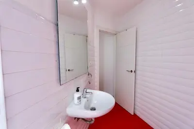 a bedroom with a bed and a flat screen tv at Tu Estudio En El Centro-Ruzafa 10A in Valencia