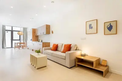 a living room with a couch and a table at B - Design apartment at El Grao close to the beach in Valencia