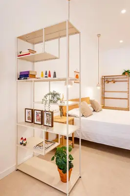 a room with a bed and a loft bed with shelves at B - Design apartment at El Grao close to the beach in Valencia