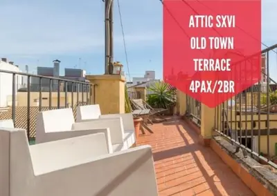 a red sign on top of a balcony with white benches at Ático Exclusivo del Siglo XVI con Terraza Privada en el Corazón de Ciutat Vella in Valencia