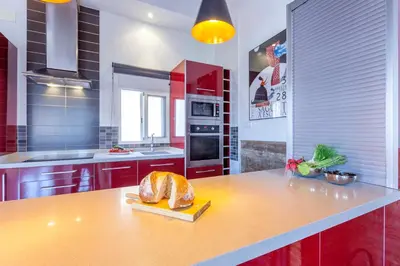 a kitchen with a table with a loaf of bread on it at Penthouse apartment historical center in Valencia