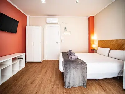 a hotel room with a bed and a tv at Estudio En El Centro-Ruzafa 10D in Valencia