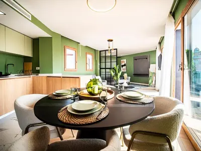 a dining room with a table and chairs at Tu Penthouse En El Centro - Ruzafa 11C in Valencia