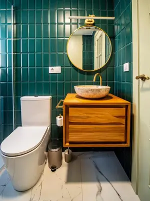 a bathroom with a toilet and a sink and a mirror at Tu Penthouse En El Centro - Ruzafa 11C in Valencia