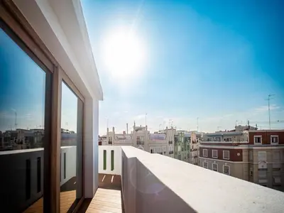 a balcony with a view of a city at Tu Penthouse En El Centro - Ruzafa 11C in Valencia