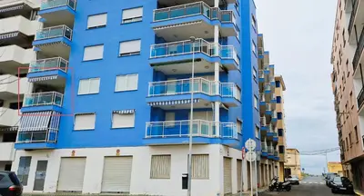 a blue building with balconies on the side of it at Mar y montaña in Nules