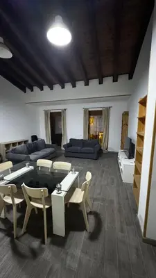a living room with a couch and a table and chairs at Plaza la REINA 3th floor & no elevator in Valencia
