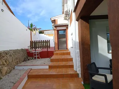 a stairway leading up to a house with a door at El otro cielo Playamonte in Navarrés