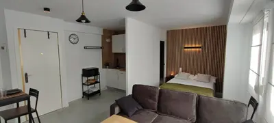 a bedroom with a couch and a bed in a room at Apartamento En La Ciudad De Las Artes y Las Ciencias in Valencia