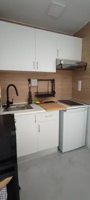 a kitchen with white cabinets and a sink at Apartamento En La Ciudad De Las Artes y Las Ciencias in Valencia