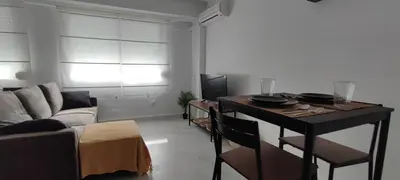 a living room with a couch and a table at Apartamento En La Ciudad De Las Artes y Las Ciencias in Valencia