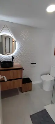 a bathroom with a sink and a toilet and a mirror at Apartamento En La Ciudad De Las Artes y Las Ciencias in Valencia